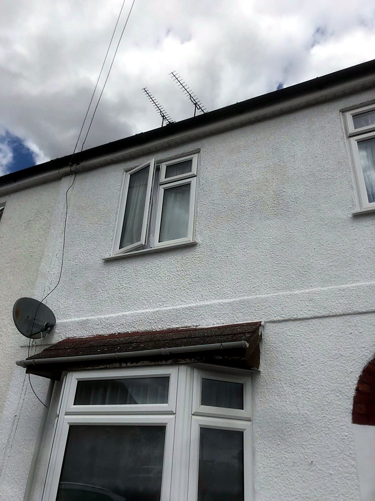 Fresh masonry paint on a rendered gable